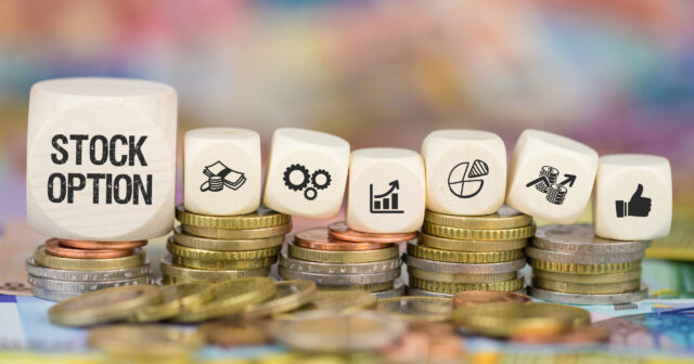 stock option cubes sitting on coins