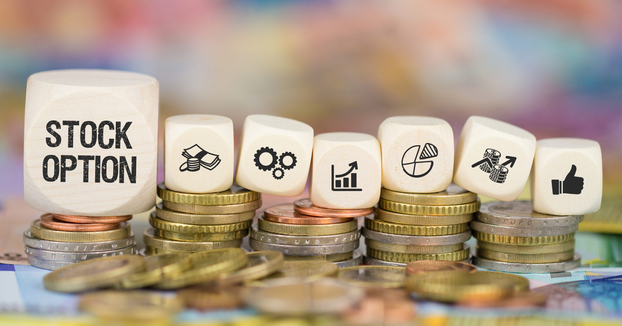 stock option cubes sitting on coins