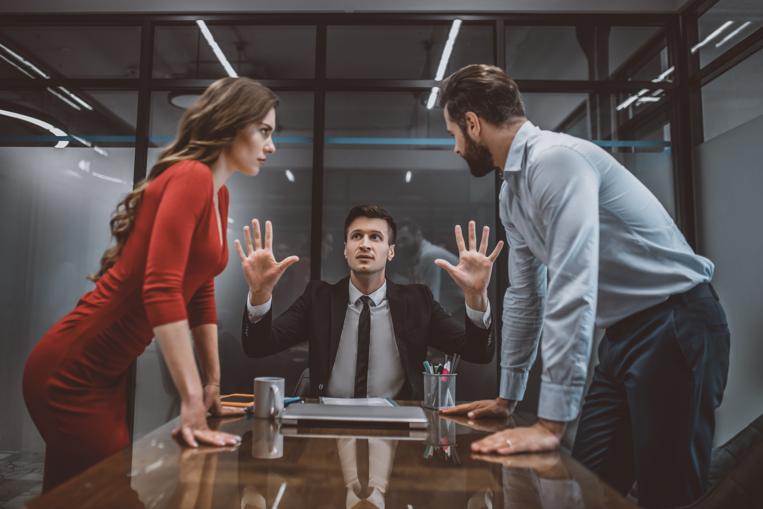 Hot argument. A mediator trying to stop the argument between spouses mediation