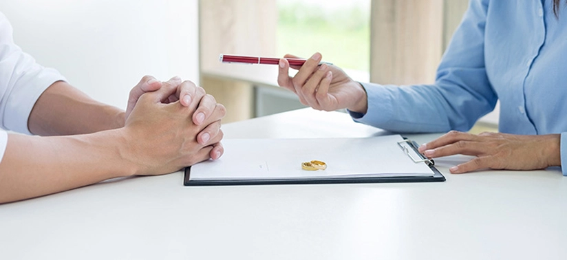 Closeup of a man Signing Contract or premarital agreement