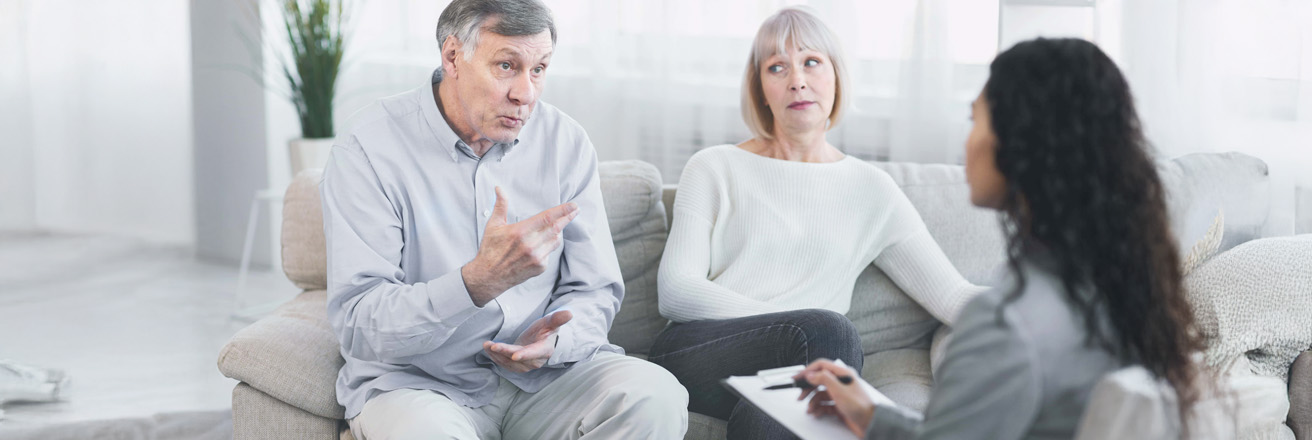 senior couple meeting with attorney