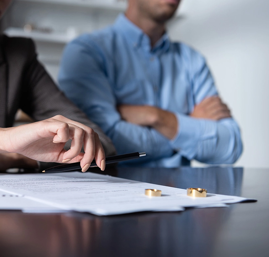 view of couple at table with divorce document