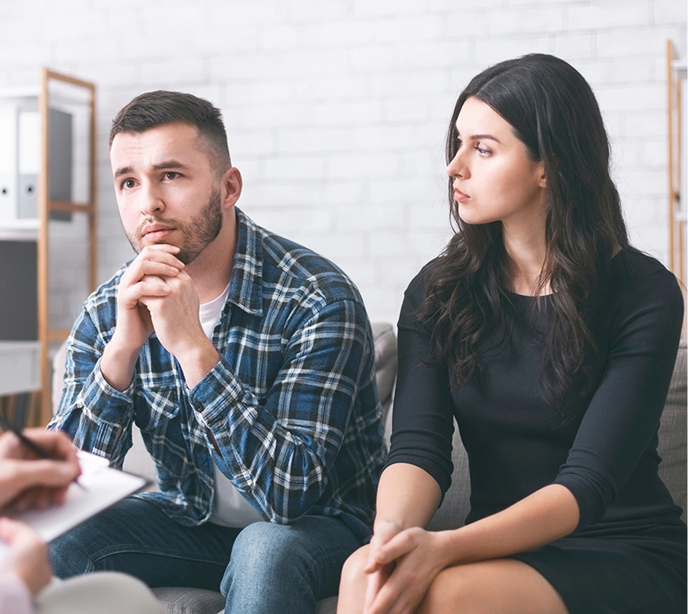 young couple sitting with a lawyer