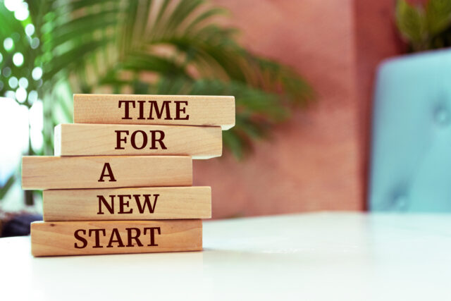 Wooden blocks with words 'Time For A New Start.